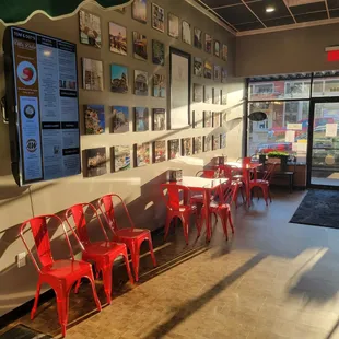 a row of red chairs in a restaurant