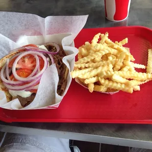 Classic gyro with fries and drink. Delicious.