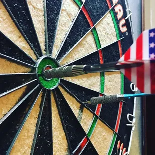 a dart in the center of a dartboard