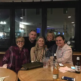 a group of people sitting at a table