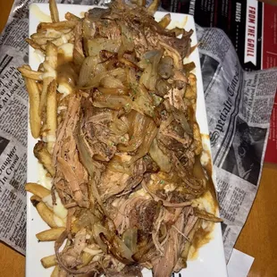 Canadian Poutine added pulled pork and onions