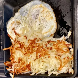Over easy eggs with hashbrowns. Breakfast served anytime. Very nice.