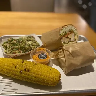 chicken sandwich with mojo sauce, corn, three grain salad, citrus piri-piri sauce. yum!