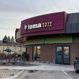 a car parked in front of the restaurant