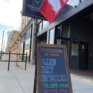 a chalk board with a sign on it