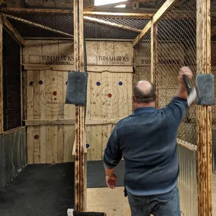 My husband throwing the axes.