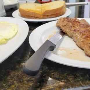 Steak, eggs over medium, hashbrowns