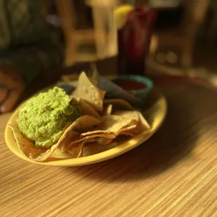 Chips and salsa with guacamole to start.