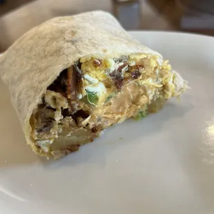 Breakfast burrito. Had just the right amount of fillings. Just needed more "kick" to it. Added dashes of Cholulu and it did the trick.