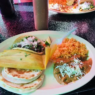 Tomatillo Platter- taco, tamale, quesadilla, rice and beans. Delicious!