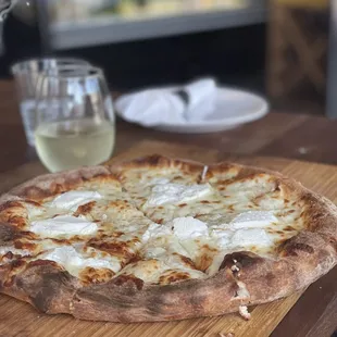 a pizza on a cutting board