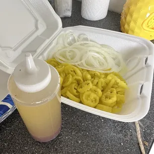 Onions/ banana peppers/homemade Italian dressing on the side for the 8ft of Italian subs. Food for the end of the school year block party!
