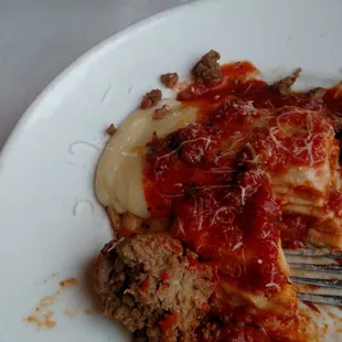 My lasagna.  Meat sauce was just broken up meatballs.  Food wasn't very hot - notice the hard "cheese slick" at 10 o'clock.