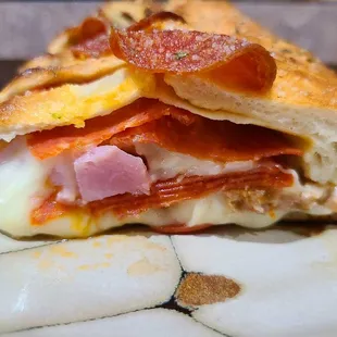 Side view of the item I received. No sauce, lots of ricotta. Delicious but not a Stromboli.