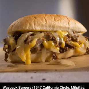 a cheeseburger on a cutting board