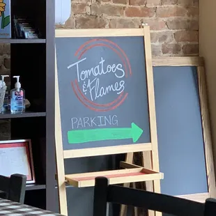 a chalkboard sign in a restaurant