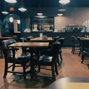 a dining area with tables and chairs