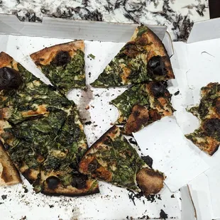This green pizza was burned to a crisp...