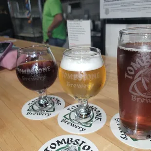 two glasses of beer on a bar