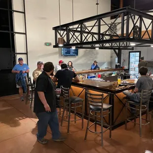 people sitting at the bar