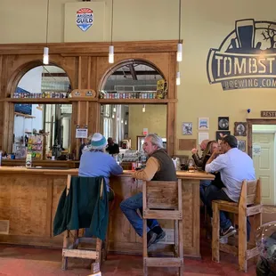 customers sitting at the bar