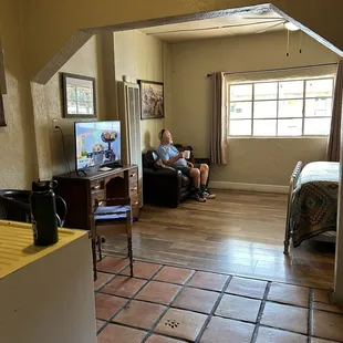 View from the bedroom out into the living room and couch and sitting area.