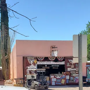 a golf cart parked in front of a store