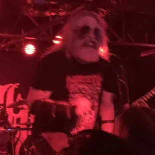 a man in a black shirt on stage