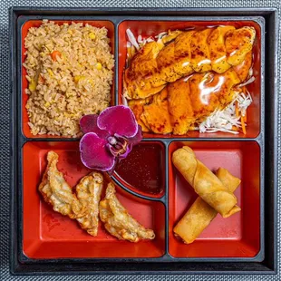 a bento box with a variety of food items