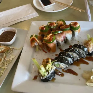 To the left the Gyoza, top right is the 911 Roll, and below it is the Salmon Tempura Roll.