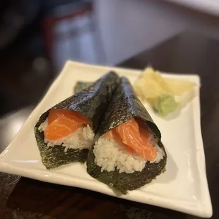 two pieces of sushi on a plate