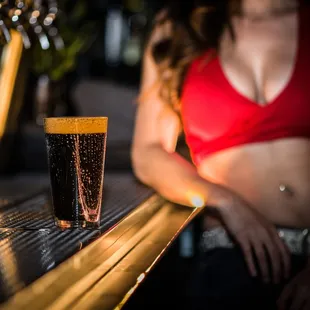 a pint of beer on a bar