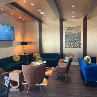 a living room with a couch and chairs