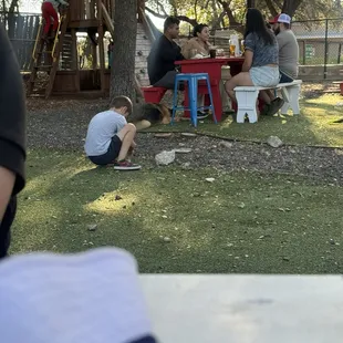 Kids slamming rocks together because of lack of anything for them to do in this big area