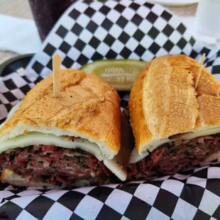 Full pastrami sandwich with cheese.