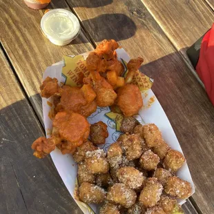 Spicy pineapple wings and garlic tots with ranch and sweet sauce