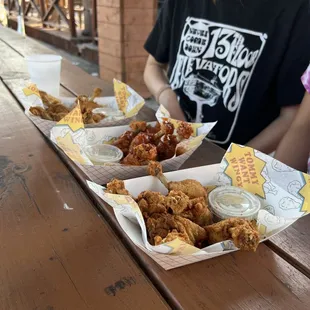 Chile lemon, lemon pepper, and OG chicken flavored wings.