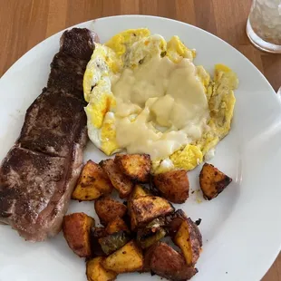 Steak and eggs with cheese added