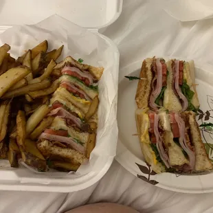A huge club sandwich, and a ton of fries. Let's eat!