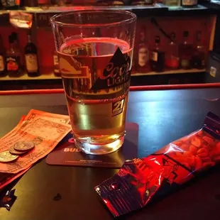 a pint of beer and chips