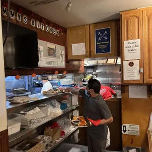 This is right next to the entrance. The food is handed out of the kitchen here.