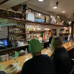 The bar is parallel to the seating area.