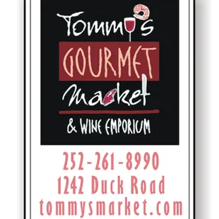 a sign for tommy&apos;s gourmet market and wine emporium
