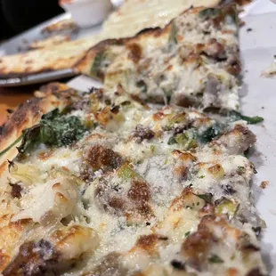 Cheese breadsticks and individual size Greek pizza. Thumbs up!