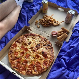 Half pepperoni half cheese pizza. Onion fries &amp; mozzarella sticks