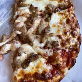Half of our small sausage pizza