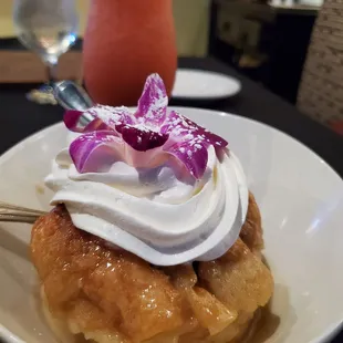 a waffle with whipped cream and flowers