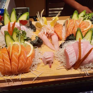 a variety of sushi on a cutting board