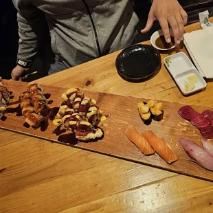 Rainbow crunch, 71 freeway, Sunkist rolls. Scallop, bluefin tuna? Salmon and yellowtail