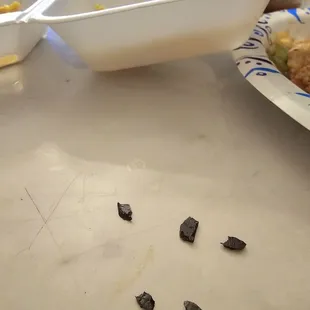 Pieces of plastic that I found in my hibachi meal. Avoid this place at all costs. Unacceptable and inhumane!